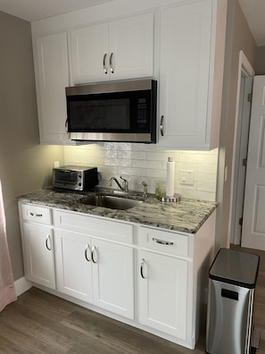 Kitchette: full sized refrigerator, microwave, sink, slow cooker; fully stocked.