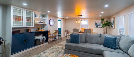 Downstairs Living Room and Dining Area with built in wall refrigerator