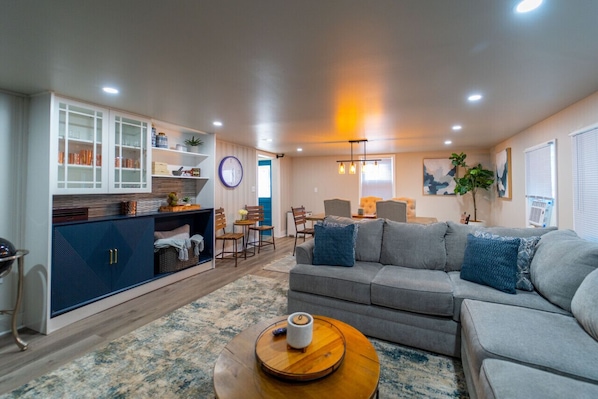 Downstairs Living Room and Dining Area with built in wall refrigerator