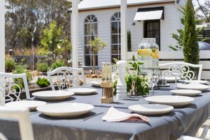 Outdoor dining with BBQ and wood fired pizza oven.