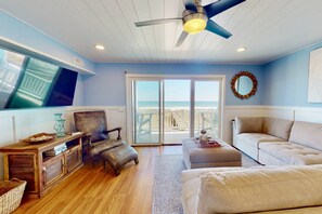 Sectional with loads of seating, flat screen tv and ocean views from this lovely living room