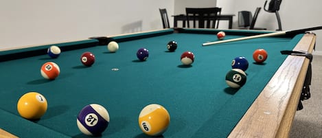 Whether you're with family or friends, our basement Game Room is the perfect place to let loose and get competitive!!  You'll find a high-quality pool table, foosball table, and carpet ball table, plus a great high table for board games and card games!