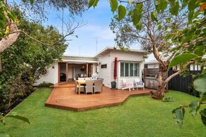 The white weatherboard exterior offers irresistible seaside charm