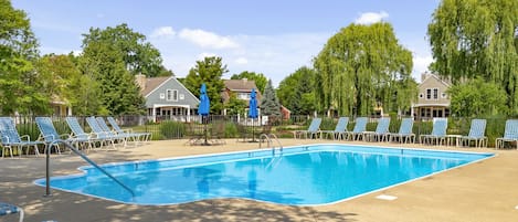 A community pool, chaise lounges and warm sun quickly get you in vacation mode!