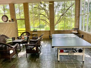 Screened in porch ready to relax and dominate at ping-pong!