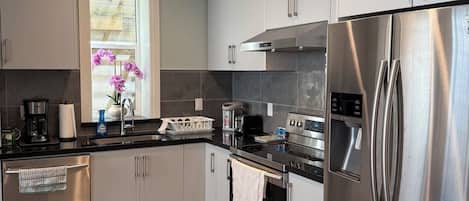 Full kitchen with stove & oven, fridge, dishwasher, microwave, Toaster, etc.