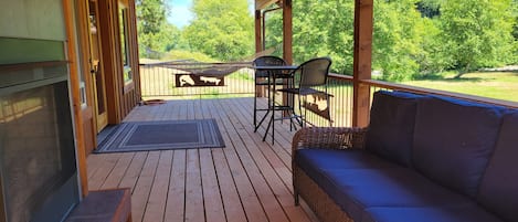 The back deck where you can enjoy the view with a cup of coffee or glass of wine