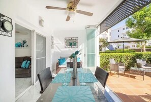 Conservatory area with glass curtains leading onto the private garden   