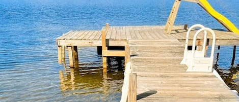 Private dock with a slide into the lake. 