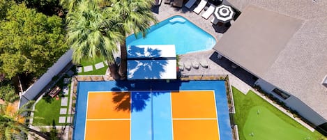 From pickleball matches to pool lounging, outdoor movie nights, grilling feasts, and putting practice — this custom-designed backyard is a one-of-a-kind retreat for endless relaxation and entertainment.