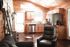 Upgraded kitchen with granite counter tops, stainless steel appliances. 