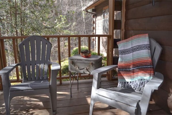 Screened-in porch at entrance.
