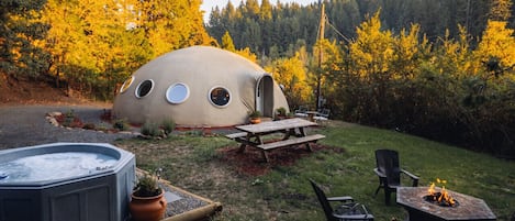 Hot tub, fire ring, picnic table, and beautiful nature setting.