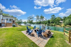 Enjoy the lakefront fire pit and brilliant sun sets across the cove.