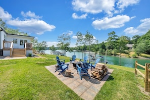 Enjoy the lakefront fire pit and brilliant sun sets across the cove.