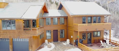 Heated sidewalk, large deck with pass-through bar window, and outdoor music.  Hot tub and gas fireplace and BBQ.