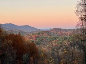 Enjoy gorgeous sunsets, autumn foliage, and mountain views from the cabin