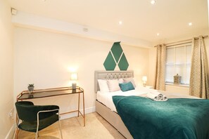 Comfortable king bed with dedicated workspace