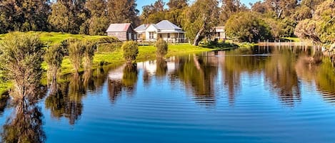 A view of the cottage from the far side of the dam 