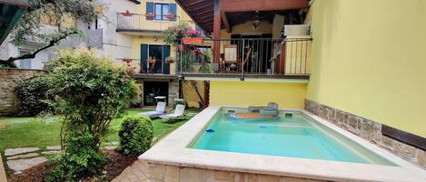 View of pool with pool & lake  toys supplied. 