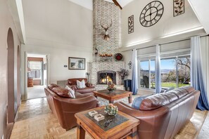 Living room with high vaulted ceilings