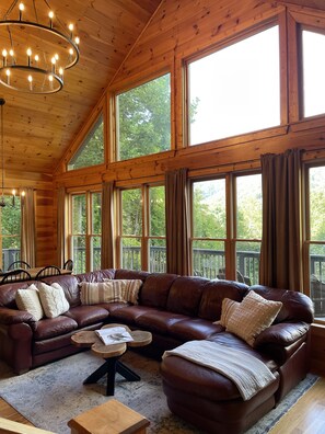 Living room and dining area with views out to the mountains