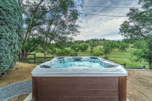 Enjoy the ultimate rejuvenating experience - unwind in our luxurious hot tub, surrounded by nature