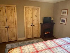 Master suite with fireplace and TV
