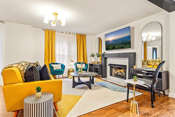 Cozy up around the warm fireplace and watch your favorite show on the 65 inch TV