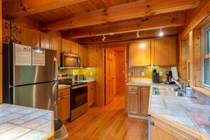 Kitchen with bar seating for 2, dishwasher & 2 types of coffeemakers (standard drip & Keurig).