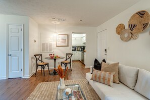 Stunning bohemian designed home with bright living space and designer furnishings. Features smart TV and connects to dining area and kitchen.