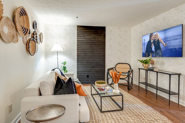 Stunning bohemian designed home with bright living space and designer furnishings. Features smart TV.