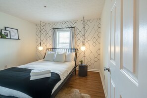 2nd bedroom with designer furnishings, and Queen bed.