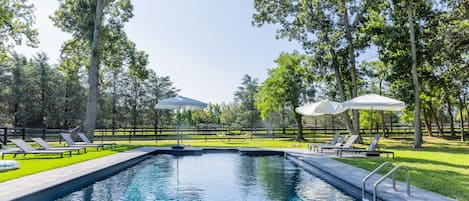 Pool overlooking horse farm 