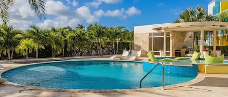 Relax in the pool while admiring the garden view.