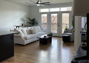 Living area w/ hightop table & 2 stools which can be used as a workstation