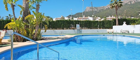 Water, Sky, Property, Plant, Swimming Pool, Blue, Azure, Shade, Outdoor Furniture, Tree