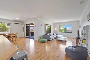 Spacious combined lounge, dining and kitchen area