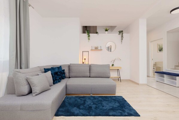 Living room with a comfortable sofa and TV. 
