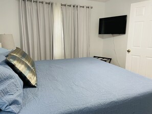 King bed and television in BR