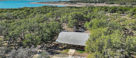 Aerial view of home showing beautiful Canyon Lake in the background.