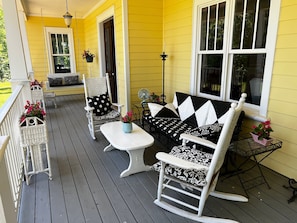 Capacious front porch with swing