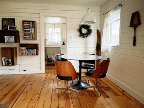 A small dining area is located just outside the kitchen. 