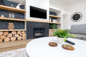Wood coasters are provided on the coffee table. The perfect place for a drink!