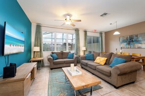 LIving room showing sofa and open floor plan.