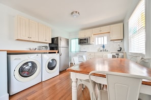 Washer/dryer with detergents and dryer sheets.