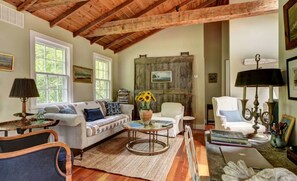 Livingroom with full size sofa and 2 comfy chairs.