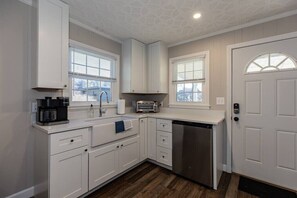 The kitchen has a mini fridge, toaster oven & coffee maker.