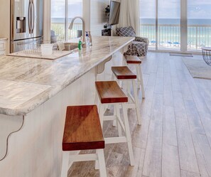 granite kitchen island has 4 stools