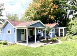 Back of Cottage - View of backyard and back of cottage showing covered patio and 3 season sunporch